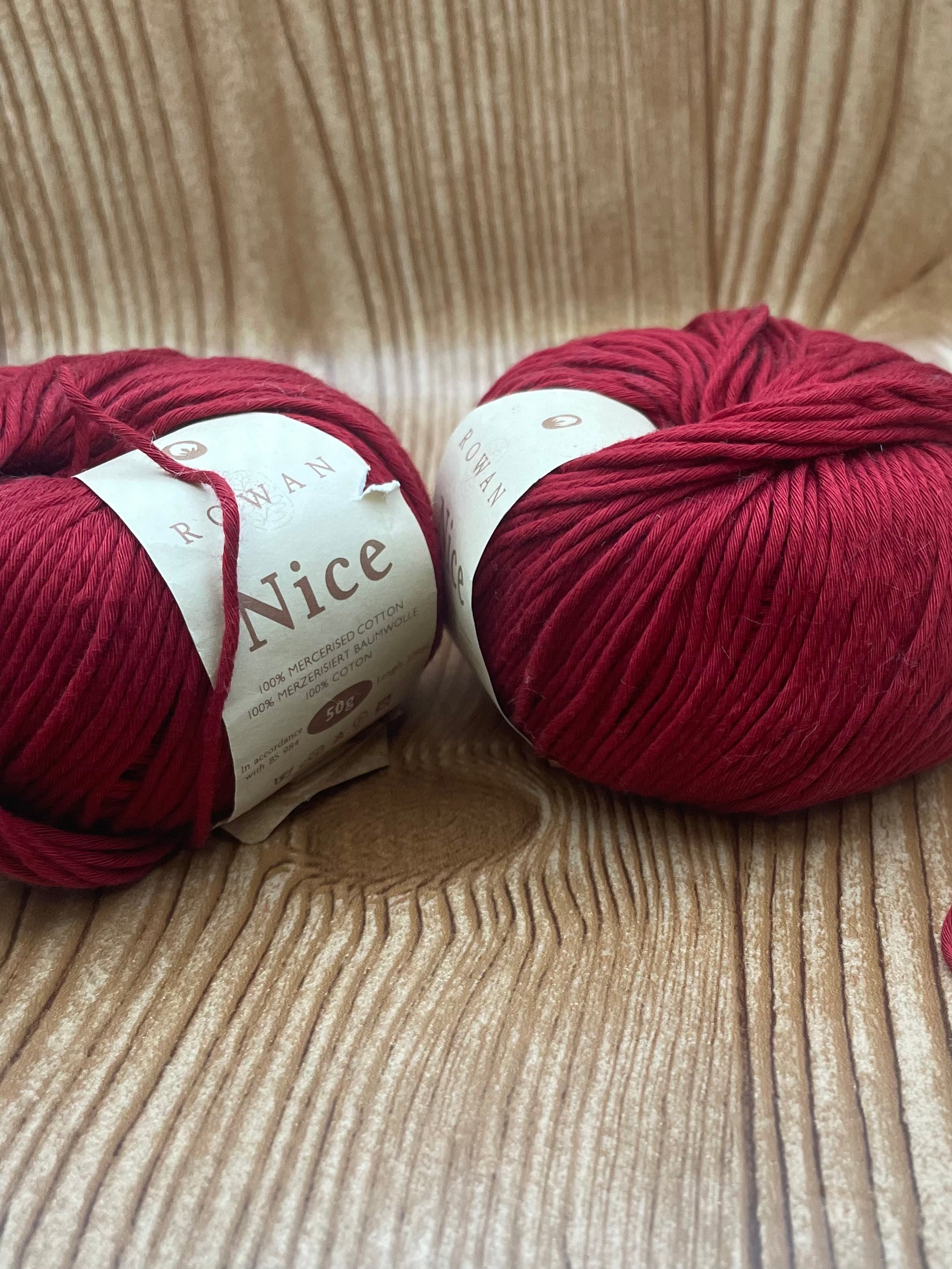 Two skeins of red yarn